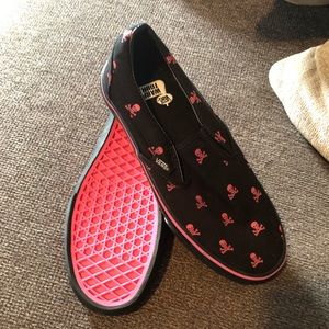 Never worn pink and black skull vans.